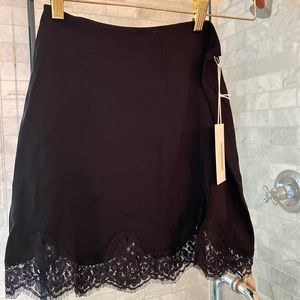 NWT Reformation Black slip style mini skirt with lace trim